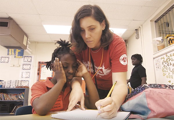 Firewall Centers staff member teaching a kid