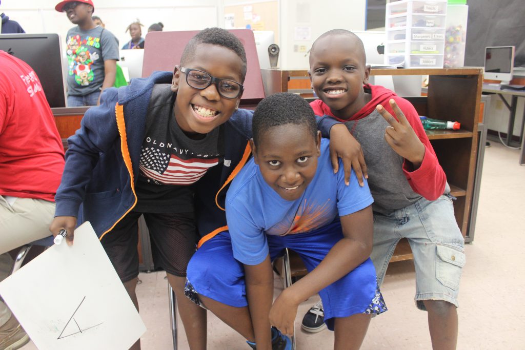 three happy students